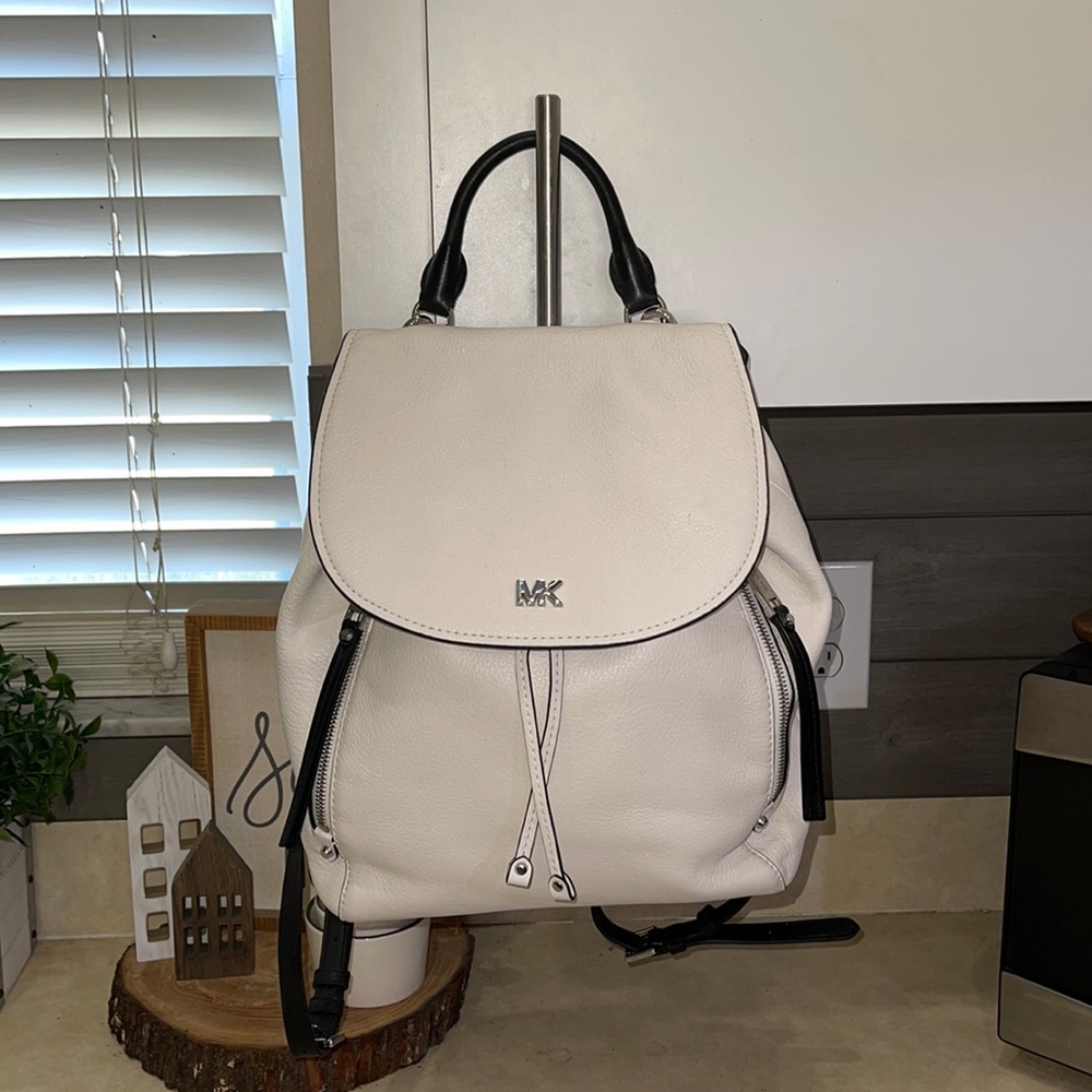 White Michael Kors backpack with silver and black accents